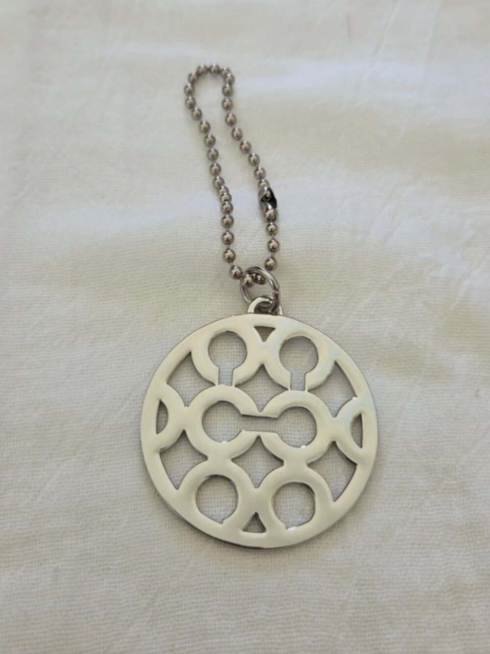 EUC - Coach Y2K Signature Cut Out Op-Art Handbag Charm - Silver
